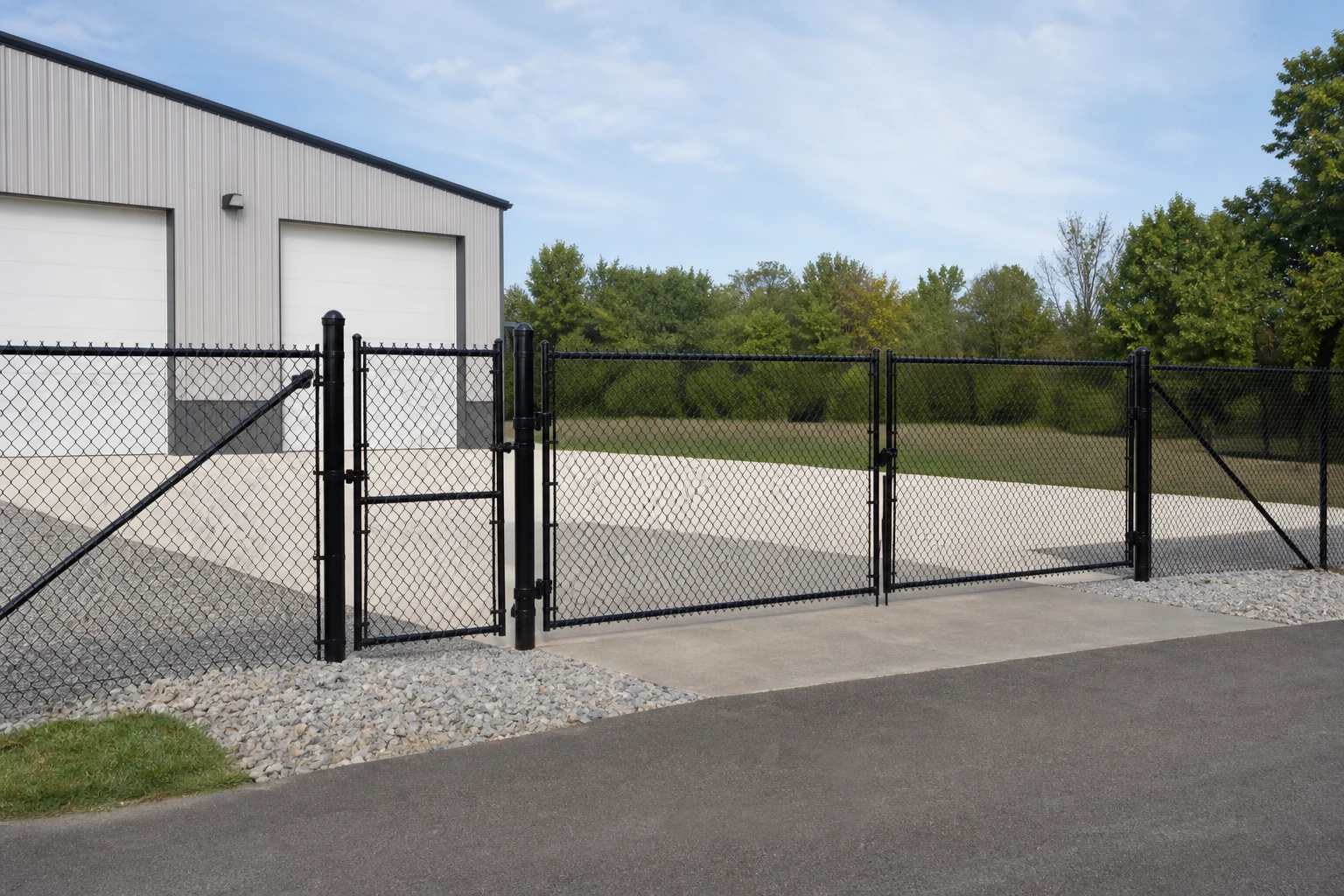 Commercial fence line with separate pedestrian and vehicle gates